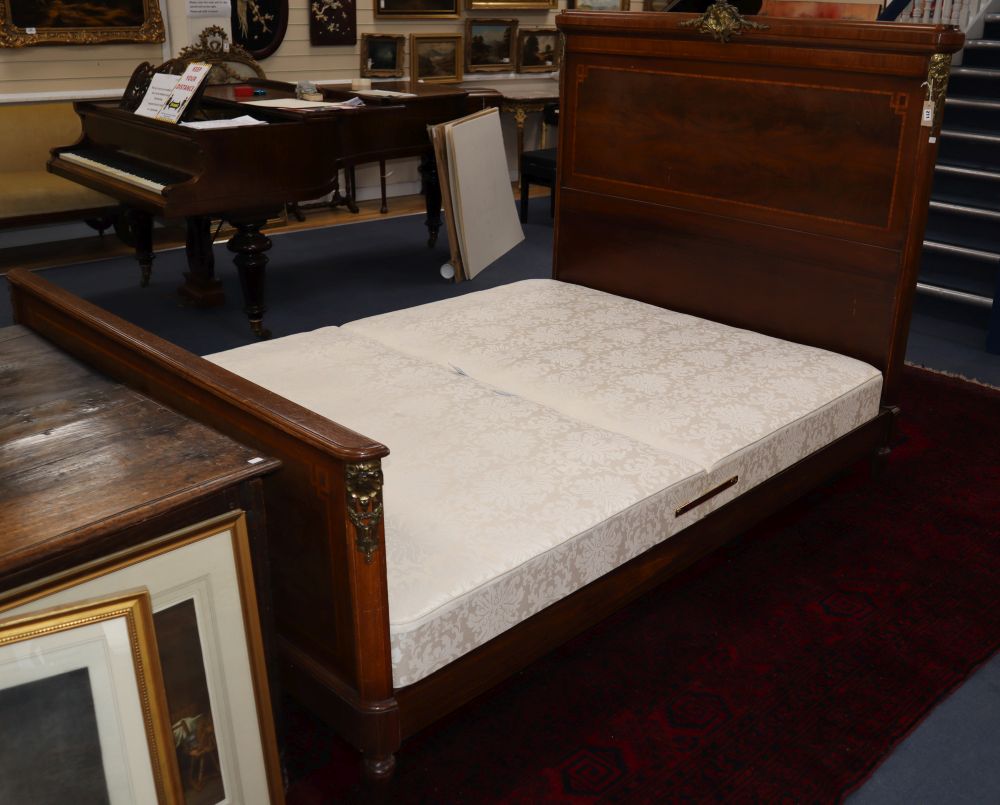 An early 20th century French inlaid and ormolu-mounted mahogany double bedstead, W.155cm